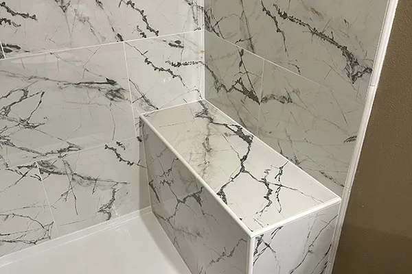 White marble tile installation by Cedar Rapids Flooring and Remodel