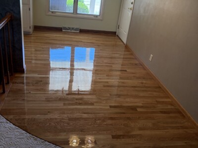Hardwood floor refinishing and custom curved shaping completed by Cedar Rapids Flooring & Remodel in Cedar Rapids, IA Refinished hardwood floors with custom curved shaping in Cedar Rapids home