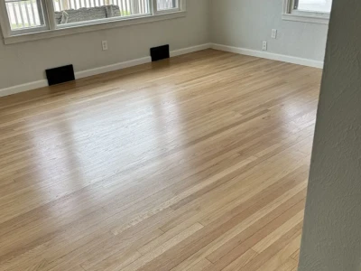 Hardwood floor installation — Cedar Rapids, IA Warm tone hardwood flooring installed in Cedar Rapids home