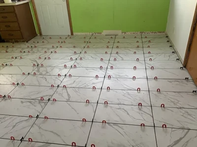 Tile flooring installation underway in Cedar Rapids home Tile floor installation in progress by Cedar Rapids Flooring and Remodel